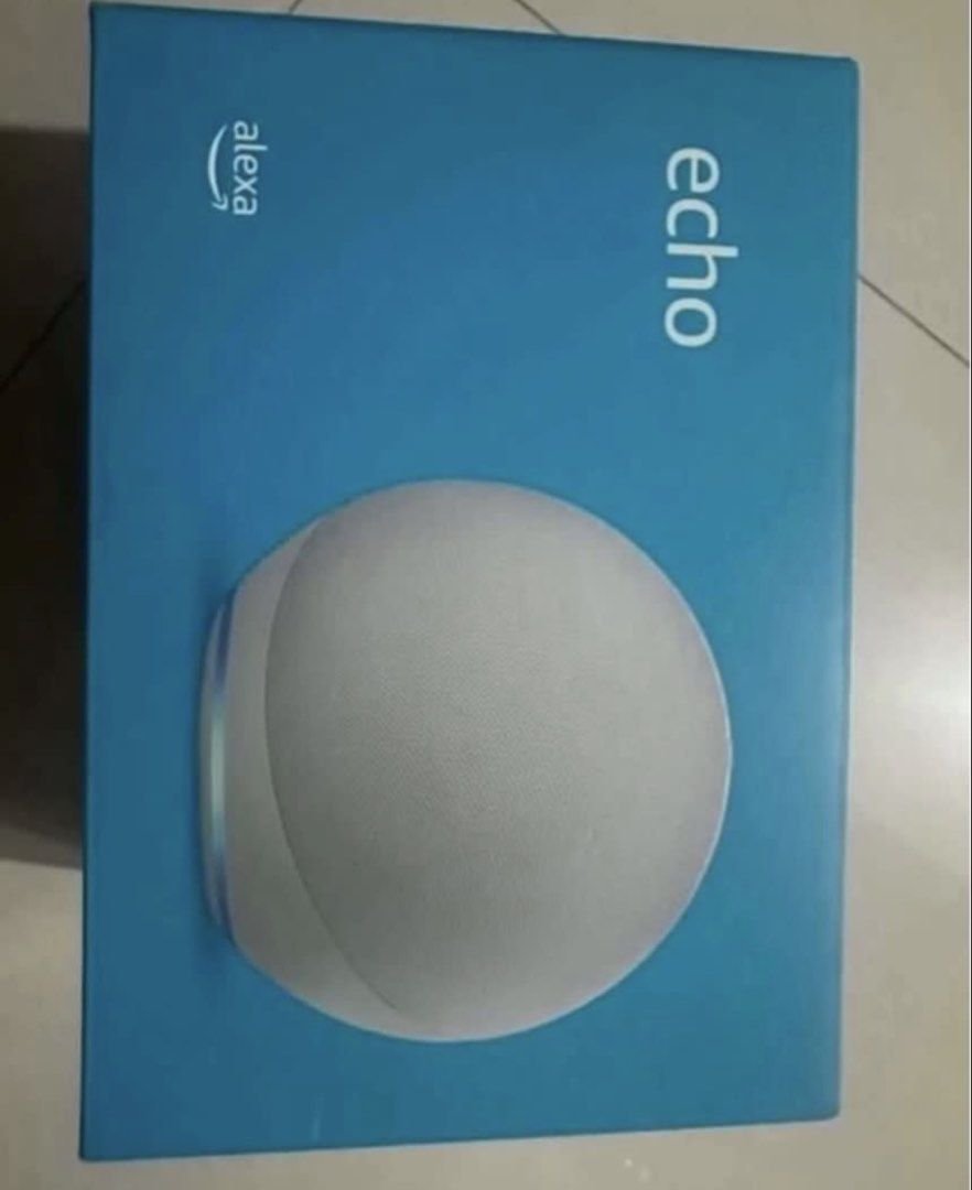 Amazon Echo (4th Gen) - White (Category: Soundbars, Speakers & Amplifiers) located in Manila. Submitted by bornthisway22 (Listing ID 1426315954, Image 2). Description: Amazon Echo (4th Gen) smart speaker in white. Features include a 3" woofer, two 0.8" tweeters, Zigbee smart home hub, Bluetooth, and a 3.5 mm line in/out port. Includes hands-free Alexa functionality. The box contains the Echo (4th gen) and power adapter. Setup requires WiFi and th