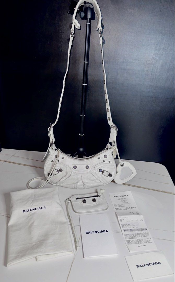 Balenciaga Le Cagole Shoulder Bag White (Category: Luxury Bags & Wallets) located in Taguig. Submitted by aa_decluttering (Listing ID 1425439486, Image 3). Description: Balenciaga Le Cagole in the highly sought-after XS size. ✨ Authenticity Guaranteed: Purchased directly from the Balenciaga flagship store. Comes with the original store receipt. **BEWARE OF FAKES** ✨ Condition: Lightly used and well-maintained. Leather is in excellent condition. ✨
