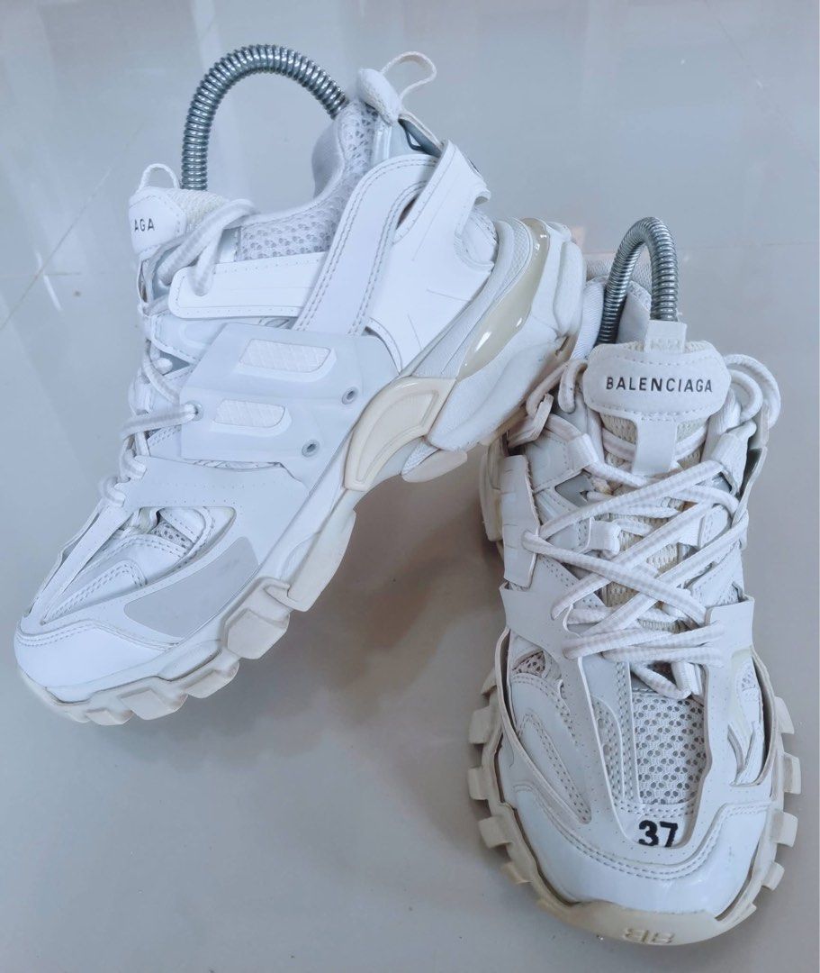 Balenciaga Track Sneakers White Size 37 (Category: Sneakers) located in Danao, Cebu. Submitted by altheaprelovedcorner (Listing ID 1426202049, Image 2). Description: White Balenciaga Track sneakers. Features the Balenciaga logo on the side and the word "track" on the back. The size is 37 EUR, 4 USA, and 3 UK. Made in China. The sneakers have a chunky sole and a multi-layered design..