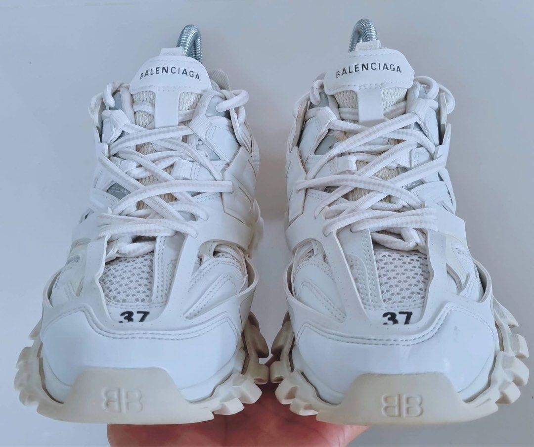 Balenciaga Track Sneakers White Size 37 (Category: Sneakers) located in Danao, Cebu. Submitted by altheaprelovedcorner (Listing ID 1426202049, Image 3). Description: White Balenciaga Track sneakers. Features the Balenciaga logo on the side and the word "track" on the back. The size is 37 EUR, 4 USA, and 3 UK. Made in China. The sneakers have a chunky sole and a multi-layered design..