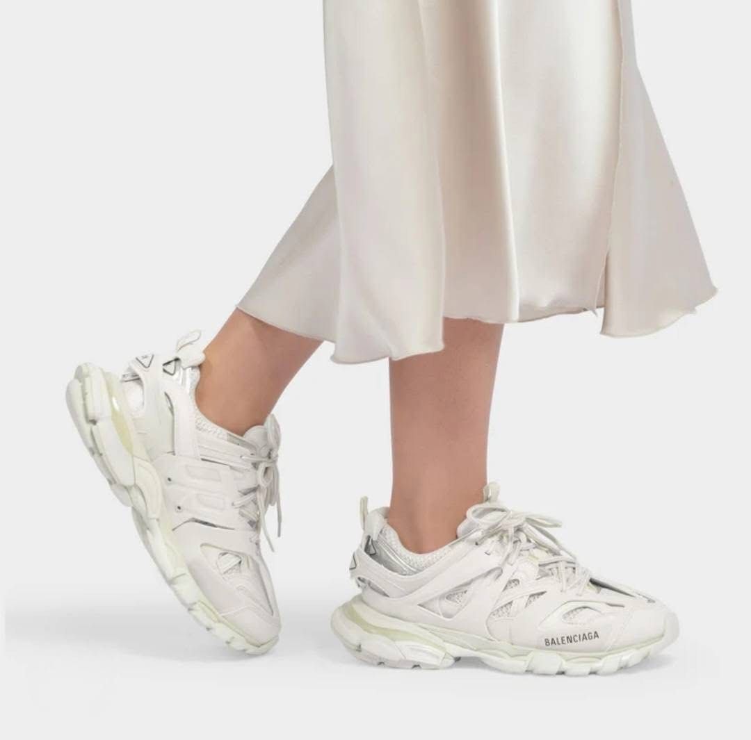 Balenciaga Track Sneakers White Size 37 (Category: Sneakers) located in Danao, Cebu. Submitted by altheaprelovedcorner (Listing ID 1426202049, Image 1). Description: White Balenciaga Track sneakers. Features the Balenciaga logo on the side and the word "track" on the back. The size is 37 EUR, 4 USA, and 3 UK. Made in China. The sneakers have a chunky sole and a multi-layered design..