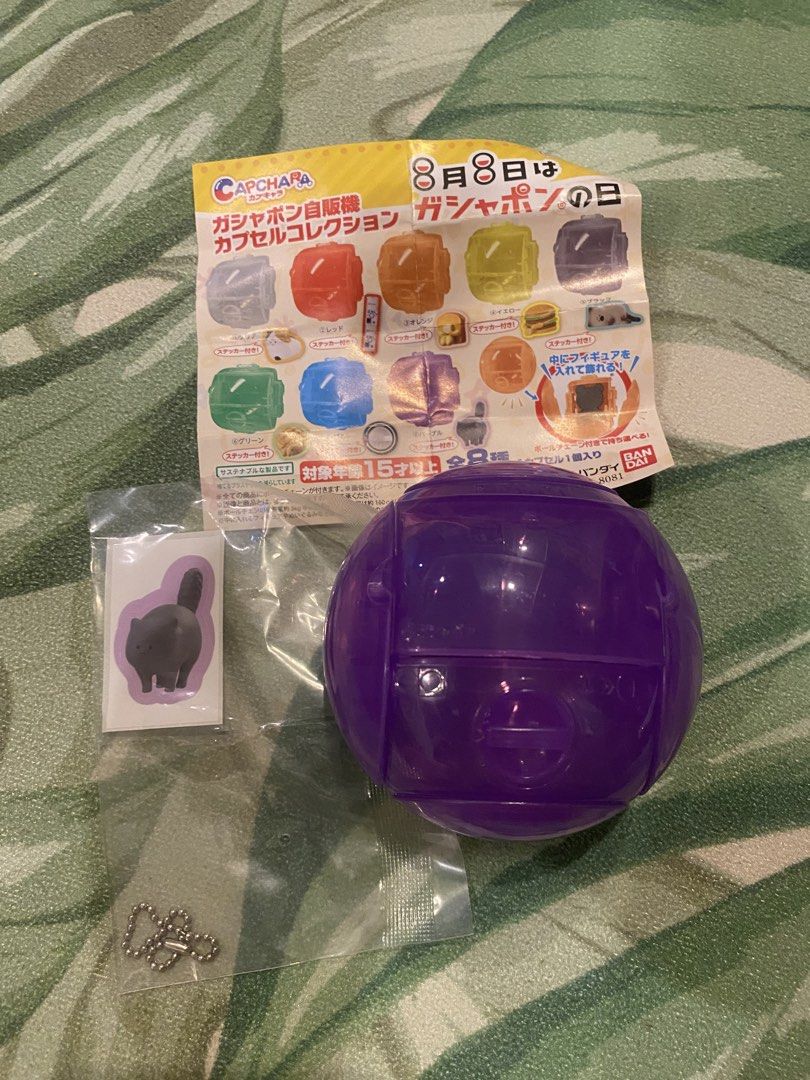 Bandai Gashapon Vending Machine Capsule Collection (Category: Designer & Blind Box Toys) located in Pasay City. Submitted by trendystash (Listing ID 1426338855, Image 1). Description: Gashapon Vending Machine Capsule Collection from Bandai. It includes a purple capsule, a sticker, and a ball chain. The capsule can be used to display a figure inside. There are 8 types in total. Target age is 15 years and older. It comes with stickers and a ball ch