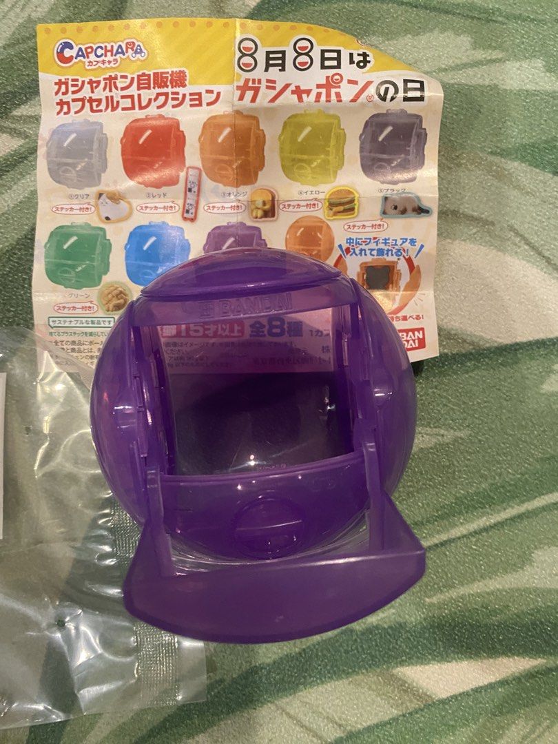 Bandai Gashapon Vending Machine Capsule Collection (Category: Designer & Blind Box Toys) located in Pasay City. Submitted by trendystash (Listing ID 1426338855, Image 2). Description: Gashapon Vending Machine Capsule Collection from Bandai. It includes a purple capsule, a sticker, and a ball chain. The capsule can be used to display a figure inside. There are 8 types in total. Target age is 15 years and older. It comes with stickers and a ball ch