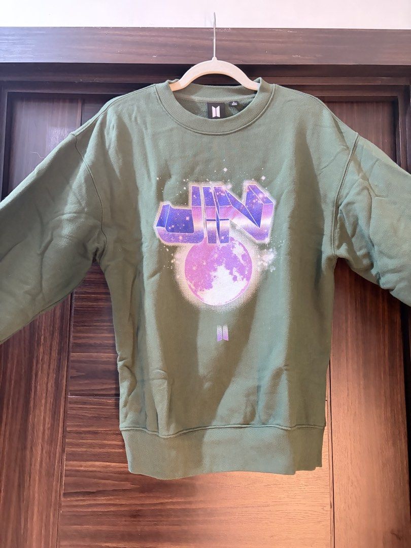 BTS Jin Sweatshirt - Olive Green - Size M (Category: Coats, Jackets and Outerwear) located in Las Pinas. Submitted by kathycv (Listing ID 1426248948, Image 1). Description: - BTS Jin Sweatshirt - Olive Green, Size M - Features a unique Jin graphic design - Made of 100% cotton - Delivery c/o buyer - Located in BGC Taguig.