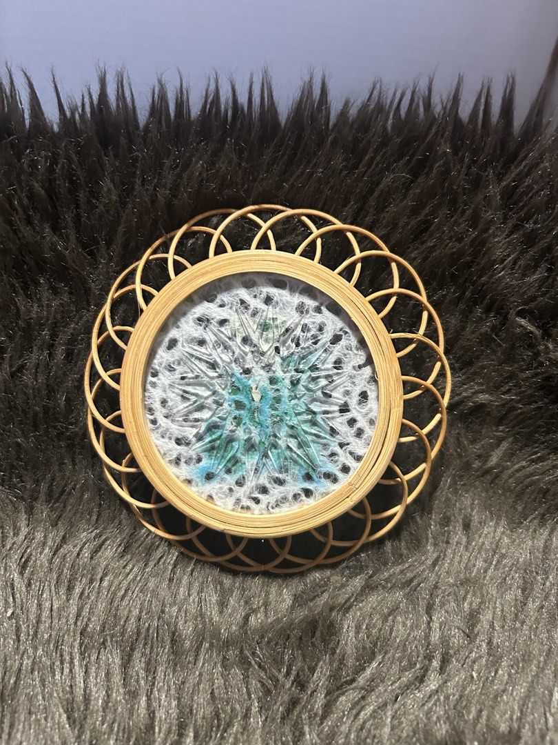 Butterfly Wall Decor with Rattan Frame (Category: Wall Decor) located in Angeles City. Submitted by zyeplustradings (Listing ID 1426382404, Image 2). Description: Unique wall decor features a beautiful butterfly design encased in a round frame. The frame is made of woven rattan, adding a natural and textured element. The butterfly is a vibrant teal color, set against a white background. It's a charming piece that can add a touch of nature-inspire