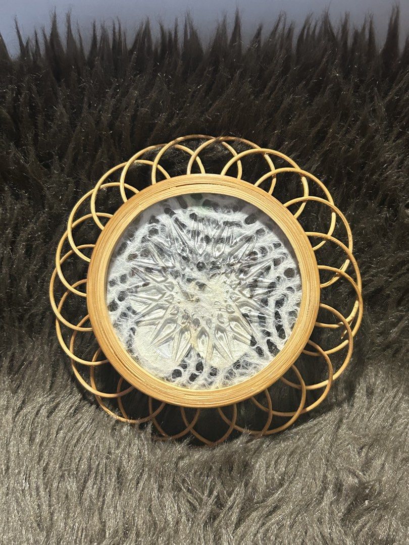 Butterfly Wall Decor with Rattan Frame (Category: Wall Decor) located in Angeles City. Submitted by zyeplustradings (Listing ID 1426382571, Image 2). Description: Unique wall decor features a preserved butterfly encased in a circular frame. The frame is made of woven rattan, adding a natural and rustic touch. The butterfly has white and yellow wings. The piece is designed to be hung on a wall..