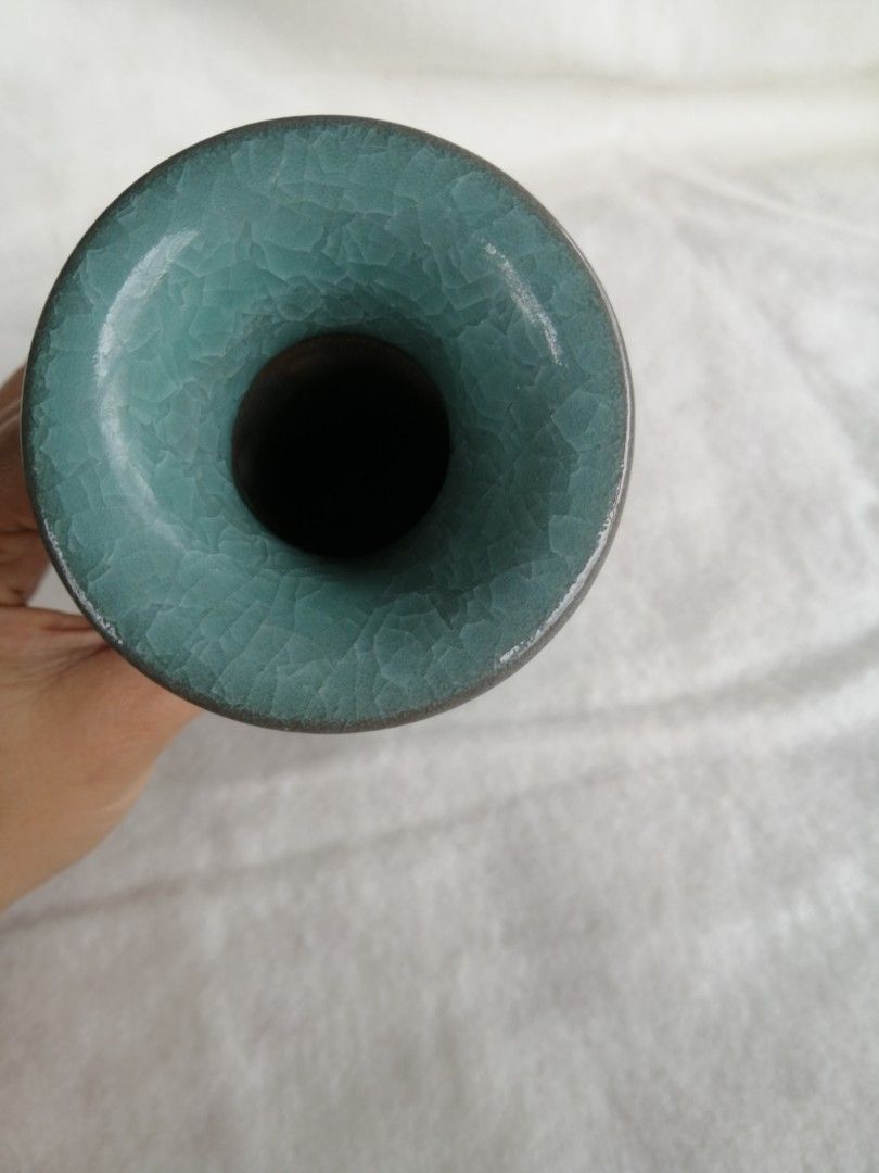 Celadon Glazed Vase with Handles Japan (Category: Vases & Decorative Bowls) located in Liloan. Submitted by aidolcapz88 (Listing ID 1426154322, Image 2). Description: Beautiful celadon glazed vase. Features a unique shape with two handles. The vase has a crackle glaze effect. The base has a marking. A decorative piece that can add a touch of elegance to any space.Ang mahal pala nito. Size 8"height.