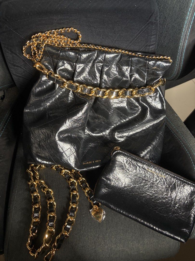 Charles & Keith Duo Double Chain Hobo Bag (Category: Luxury Bags & Wallets) located in Manila. Submitted by margsdeclutter (Listing ID 1426201005, Image 2). Description: Bought this November 2023. I rarely used it, this is like brand new pa. With pouch and extra chain for crossbody..