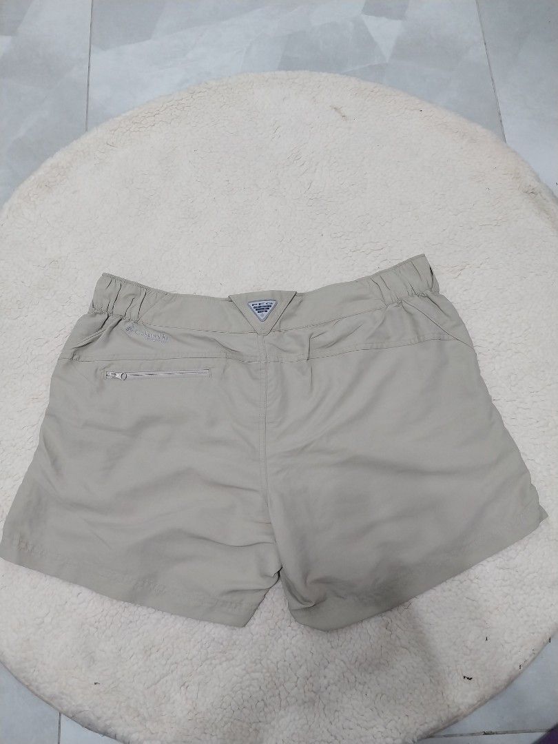 Columbia Shorts (Category: Shorts) located in Malaybalay. Submitted by markdaumar08466 (Listing ID 1426217526, Image 2). Description: Columbia shorts in a neutral color. Features a zipper pocket and elastic waistband. Includes two buttons at the front. The shorts have a Columbia logo. The size and care instructions are visible on the inside tag..