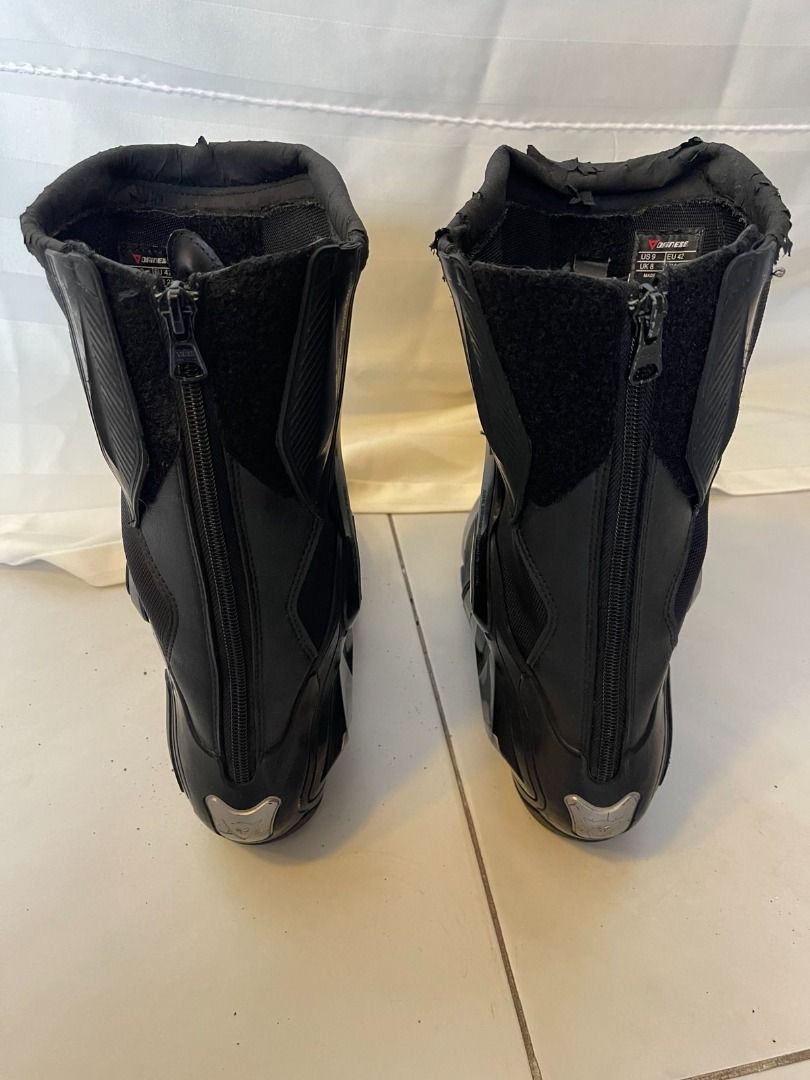 Dainese Torque D1 Out Boots (Category: Boots) located in Muntinlupa City. Submitted by execoffic56216 (Listing ID 1426245226, Image 2). Description: Black Dainese Torque D1 Out motorcycle boots. Features a zipper closure on the back and Dainese logo on the side. The boots have some wear and tear on the top edges. Includes size information on the inside of the boots. NEGOTIABLE!!.