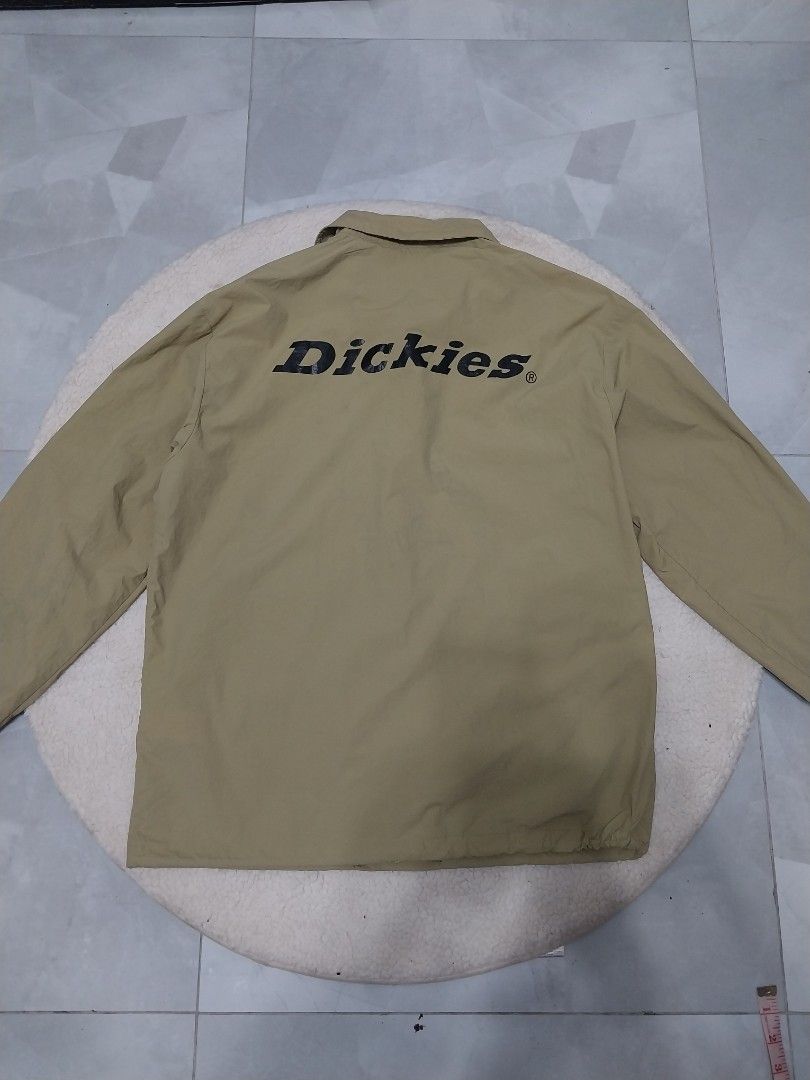 Dickies Jacket XL (Category: Coats, Jackets and Outerwear) located in Malaybalay. Submitted by markdaumar08466 (Listing ID 1426216303, Image 2). Description: Khaki Dickies jacket. Features a button-up front, collar, and the Dickies logo on the front and back. The jacket has a red Dickies patch on the front. Size XL. Made of 100% polyester..