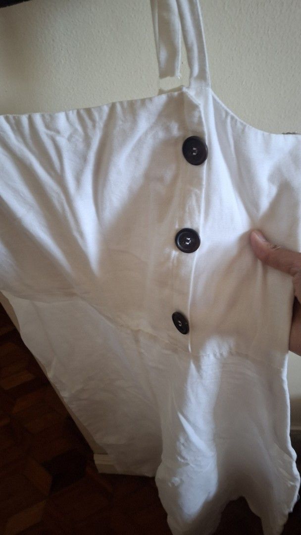 Dorothy Perkins White Linen Jumpsuit (Category: Jumpsuits) located in Las Pinas. Submitted by mgr29 (Listing ID 1426245254, Image 3). Description: White linen jumpsuit from Dorothy Perkins. Features a button-down front and spaghetti straps. The jumpsuit has a wide leg design. Size indicated is EUR 36, UK 10. Made in Turkey..