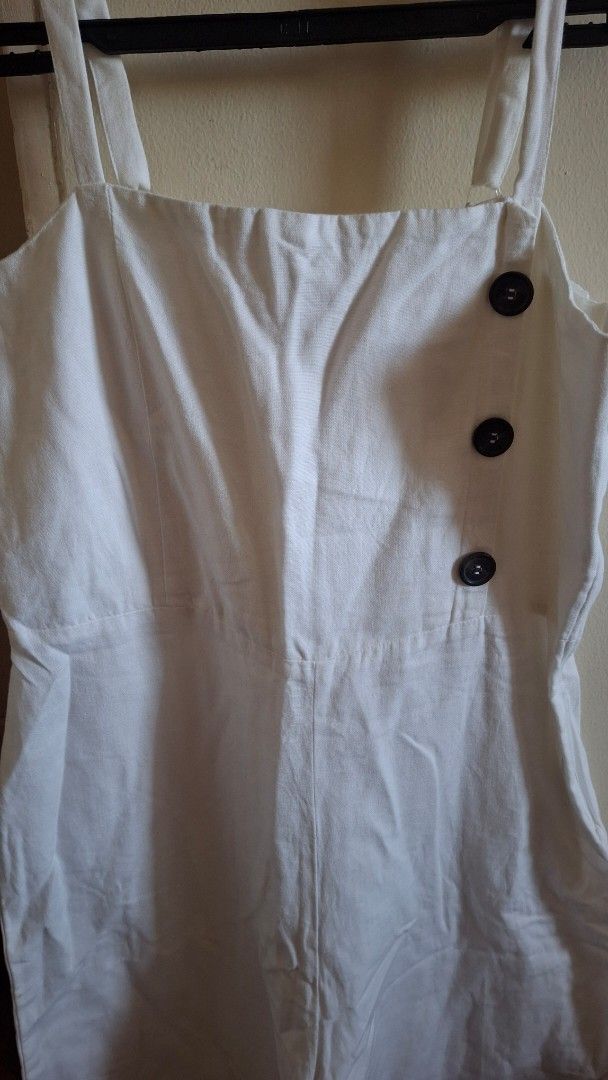 Dorothy Perkins White Linen Jumpsuit (Category: Jumpsuits) located in Las Pinas. Submitted by mgr29 (Listing ID 1426245254, Image 2). Description: White linen jumpsuit from Dorothy Perkins. Features a button-down front and spaghetti straps. The jumpsuit has a wide leg design. Size indicated is EUR 36, UK 10. Made in Turkey..