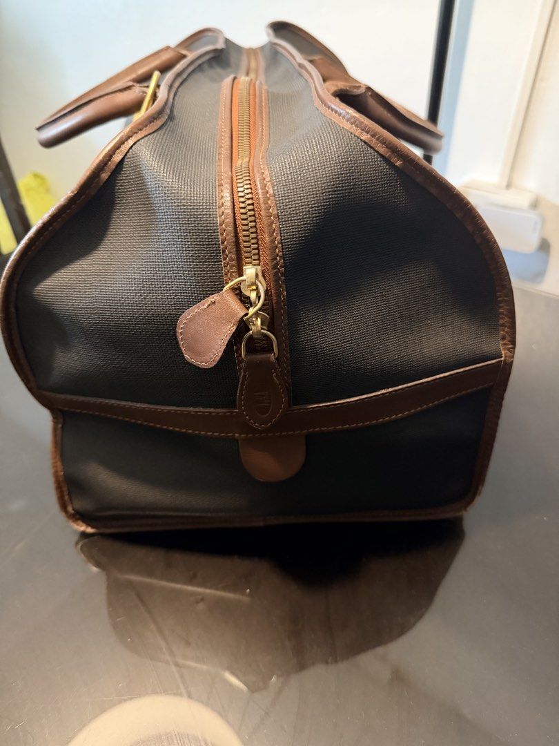Dunhill Duffle Bag with Leather Accents (Category: Luxury Bags & Wallets) located in Cainta. Submitted by randomstuff29 (Listing ID 1426362384, Image 3). Description: Condition:8/10 w/ bag tag, lock & key L19.5” H10” W11” .