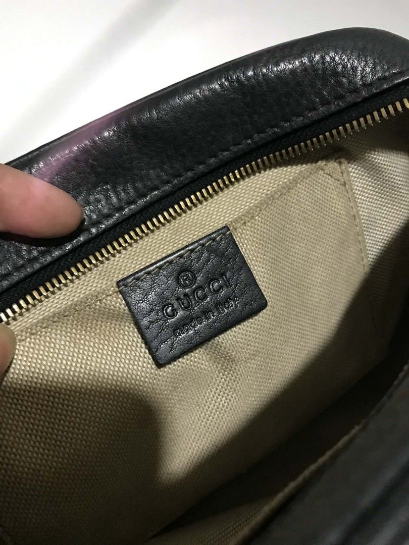 Gucci Soho Disco Bag Black (Category: Luxury Bags & Wallets) located in Davao. Submitted by purple_stitch87 (Listing ID 1426292274, Image 3). Description: Gucci Soho Disco bag in black. Features a leather exterior with the iconic interlocking GG logo. Includes a detachable shoulder strap and a tassel zipper pull. The interior has a fabric lining and a small pocket. The bag has a zipper closure. The serial number is 308364 151670..