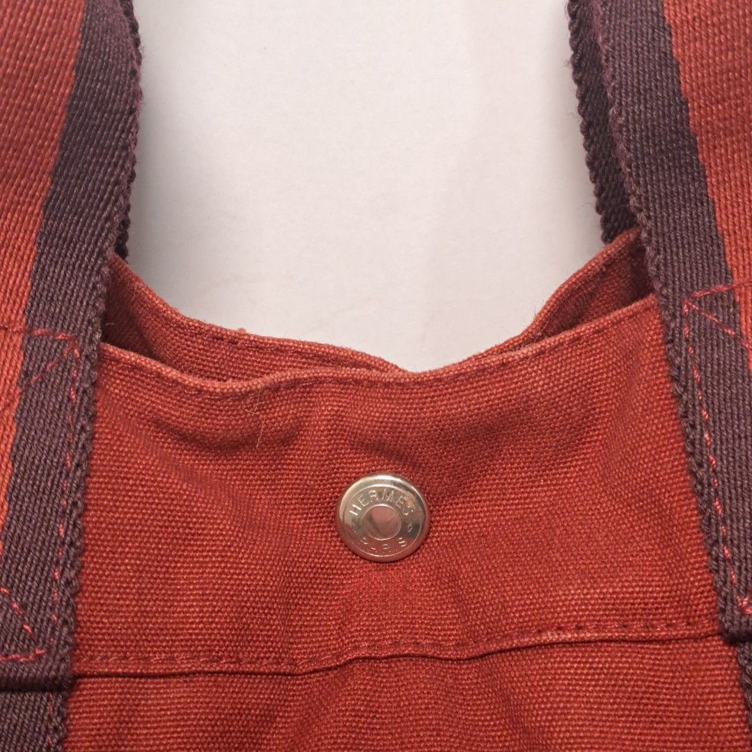 Hermes Paris Canvas Tote Bag Maroon (Category: Luxury Bags & Wallets) located in Caloocan City. Submitted by 2ndhand.manila (Listing ID 1426238832, Image 2). Description: 18 in x 12 H x 5 D ▪️NO COD/COP ▪️Ship thru J&T ▪️Lalamove/Grab Express ▪️G-Cash or Bank Transfer ▪️Location: North Caloocan.