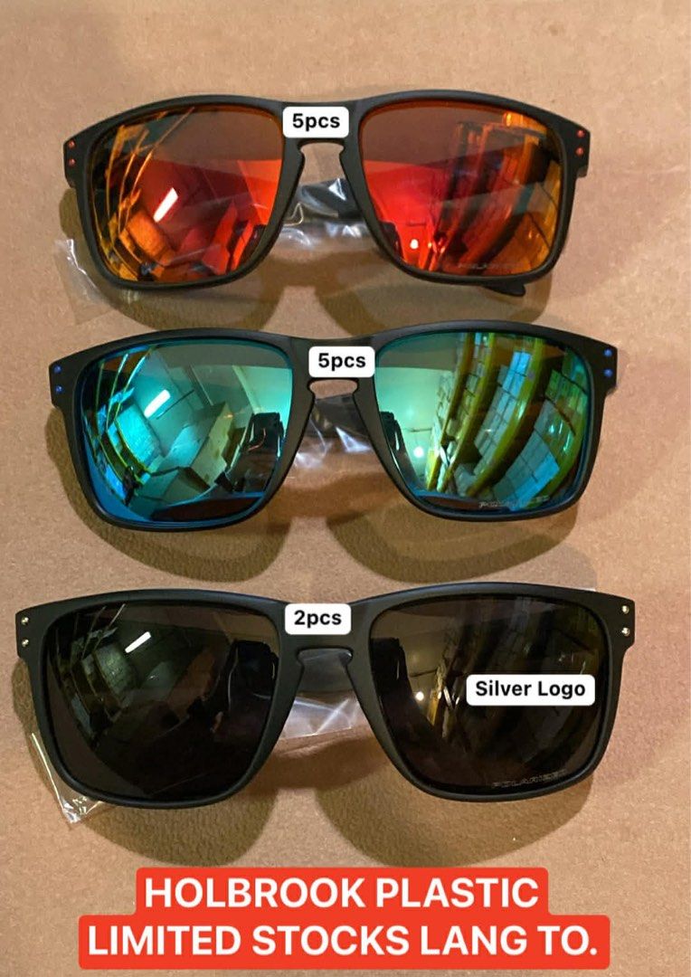 Holbrook Plastic Sunglasses - Limited Stocks (Category: Sunglasses & Eyewear) located in San Juan City. Submitted by chicqui (Listing ID 1426249028, Image 1). Description: Stylish Holbrook Plastic sunglasses available in various colors. Includes models with red, green, and black lenses. Some models feature a silver logo. Limited stock available. Also available are Holbrook Mix sunglasses in all brown, and Jupiter Carbon sunglasses with blue and g