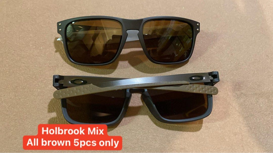 Holbrook Plastic Sunglasses - Limited Stocks (Category: Sunglasses & Eyewear) located in San Juan City. Submitted by chicqui (Listing ID 1426249028, Image 3). Description: Stylish Holbrook Plastic sunglasses available in various colors. Includes models with red, green, and black lenses. Some models feature a silver logo. Limited stock available. Also available are Holbrook Mix sunglasses in all brown, and Jupiter Carbon sunglasses with blue and g