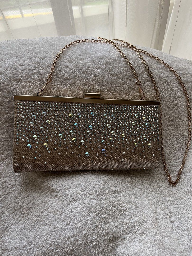 Jessica McClintock Crystal-Studded Cluth Bag (Category: Clutches) located in Quezon City. Submitted by reviverevolution (Listing ID 1426224569, Image 1). Description: - Jessica McClintock Crystal-Studded Cluth Bag - Color: Rose gold - Comes with chain strap - Bought from Rustan’s - Can fit one iPhone and other thin stuff - Payment Methods: GCash / BPI / BDO - Delivery via LBC / J&T pick-up / Lalamove pick-up. Delivery fee and pick-up booking c/o 