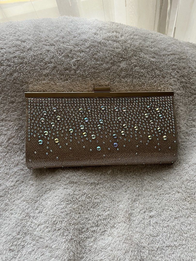 Jessica McClintock Crystal-Studded Cluth Bag (Category: Clutches) located in Quezon City. Submitted by reviverevolution (Listing ID 1426224569, Image 3). Description: - Jessica McClintock Crystal-Studded Cluth Bag - Color: Rose gold - Comes with chain strap - Bought from Rustan’s - Can fit one iPhone and other thin stuff - Payment Methods: GCash / BPI / BDO - Delivery via LBC / J&T pick-up / Lalamove pick-up. Delivery fee and pick-up booking c/o 