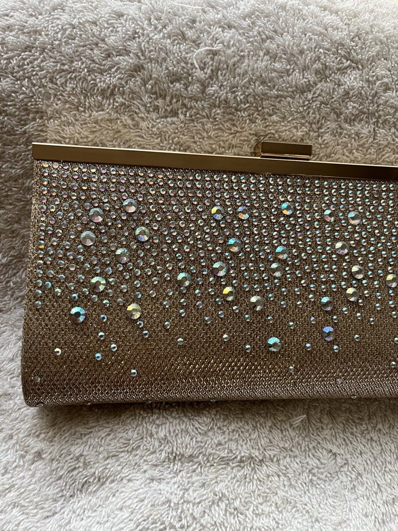 Jessica McClintock Crystal-Studded Cluth Bag (Category: Clutches) located in Quezon City. Submitted by reviverevolution (Listing ID 1426224569, Image 2). Description: - Jessica McClintock Crystal-Studded Cluth Bag - Color: Rose gold - Comes with chain strap - Bought from Rustan’s - Can fit one iPhone and other thin stuff - Payment Methods: GCash / BPI / BDO - Delivery via LBC / J&T pick-up / Lalamove pick-up. Delivery fee and pick-up booking c/o 