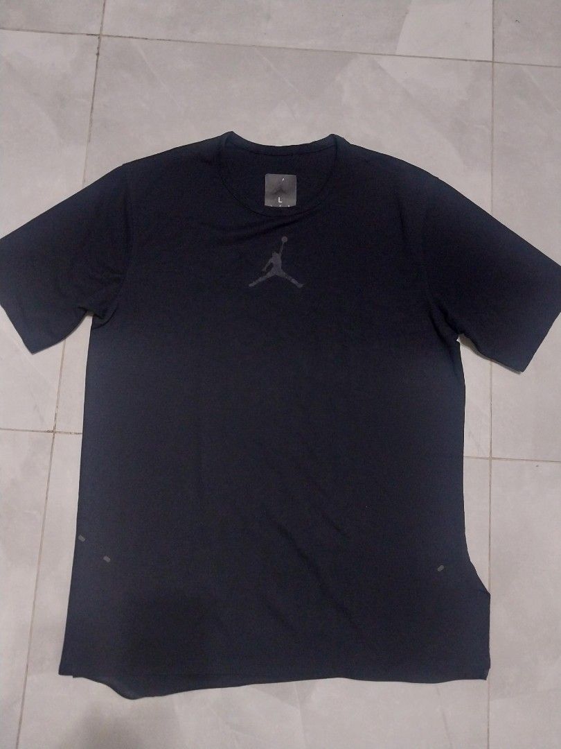 Jordan Black T-shirt - Size L (Category: Tshirts & Polo Shirts ) located in Malaybalay. Submitted by markdaumar08466 (Listing ID 1426301236, Image 1). Description: Black Jordan t-shirt. Features the iconic Jumpman logo on the chest and the brand name on the sleeve. The size is Large. Made with a breathable fabric, suitable for sports or casual wear. The tag is visible in the image. A versatile addition to any wardrobe..