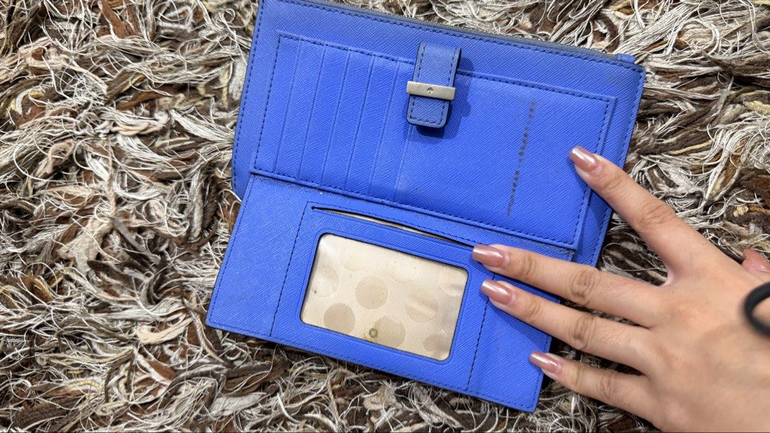 Kate Spade Blue Wallet (Category: Wallets & Card holders) located in Pasig City. Submitted by ysa.declutters (Listing ID 1426364253, Image 2). Description: Flaws as seen on photos.