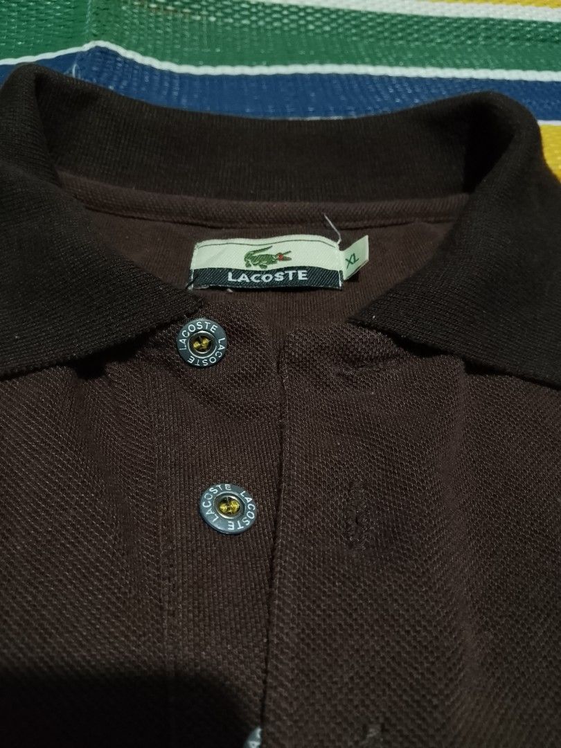 Lacoste Brown Polo Shirt XL (Category: Tshirts & Polo Shirts ) located in Mabalacat. Submitted by zero2mthrift (Listing ID 1426326464, Image 3). Description: Dimes 24 Width 28 Length Boxy Type Bodyfit Excellent condition No issue Authentic/Vtg.