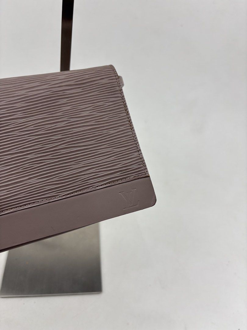 Louis Vuitton Lilac Epi Leather Honfleur (Category: Luxury Bags & Wallets) located in Makati City. Submitted by ragrepository (Listing ID 1426209852, Image 3). Description: Louis Vuitton Lilac Epi Leather Honfleur Clutch Bag Height-4” Width-8.5” Depth- 1” Handle drop-9.5” Condition-8/10 Flaw-Signs of wear, needs cleaning .