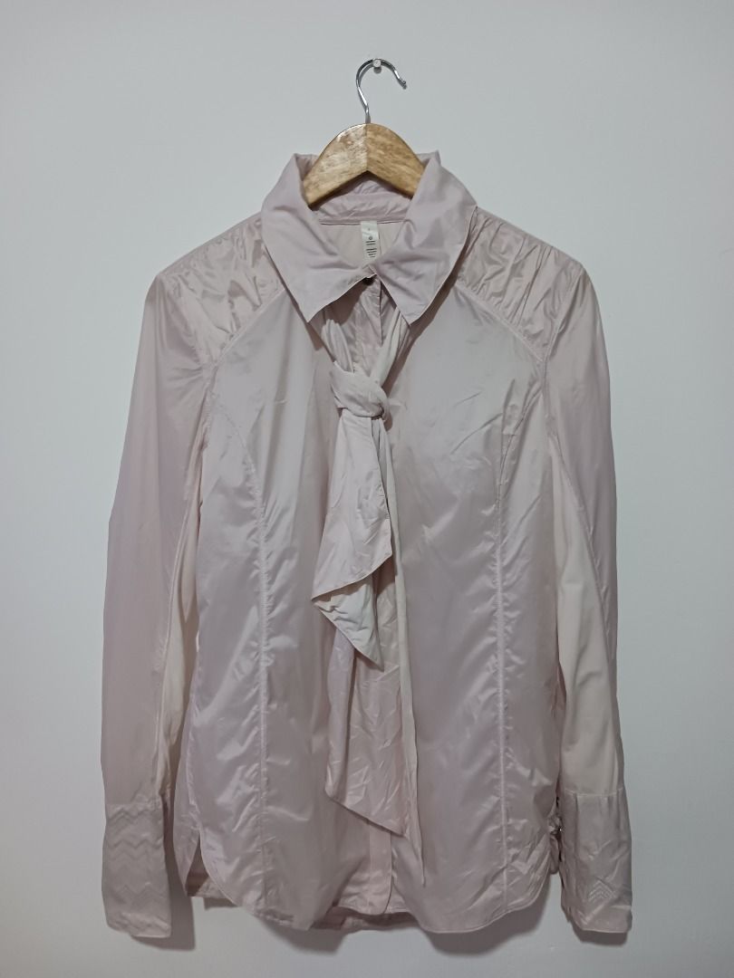 Lululemon Athletica Lightweight Jacket Size 8 (Category: Coats, Jackets and Outerwear) located in Subic. Submitted by thriftpoison (Listing ID 1426310052, Image 1). Description: Lightweight Lululemon jacket in a light pink color. Features a collared neckline and a zip-up front. The jacket has a unique design with pleated details on the shoulders and sleeves. It includes a tie detail at the neck. Size 8.Length 27 width 19 lightly used 899.