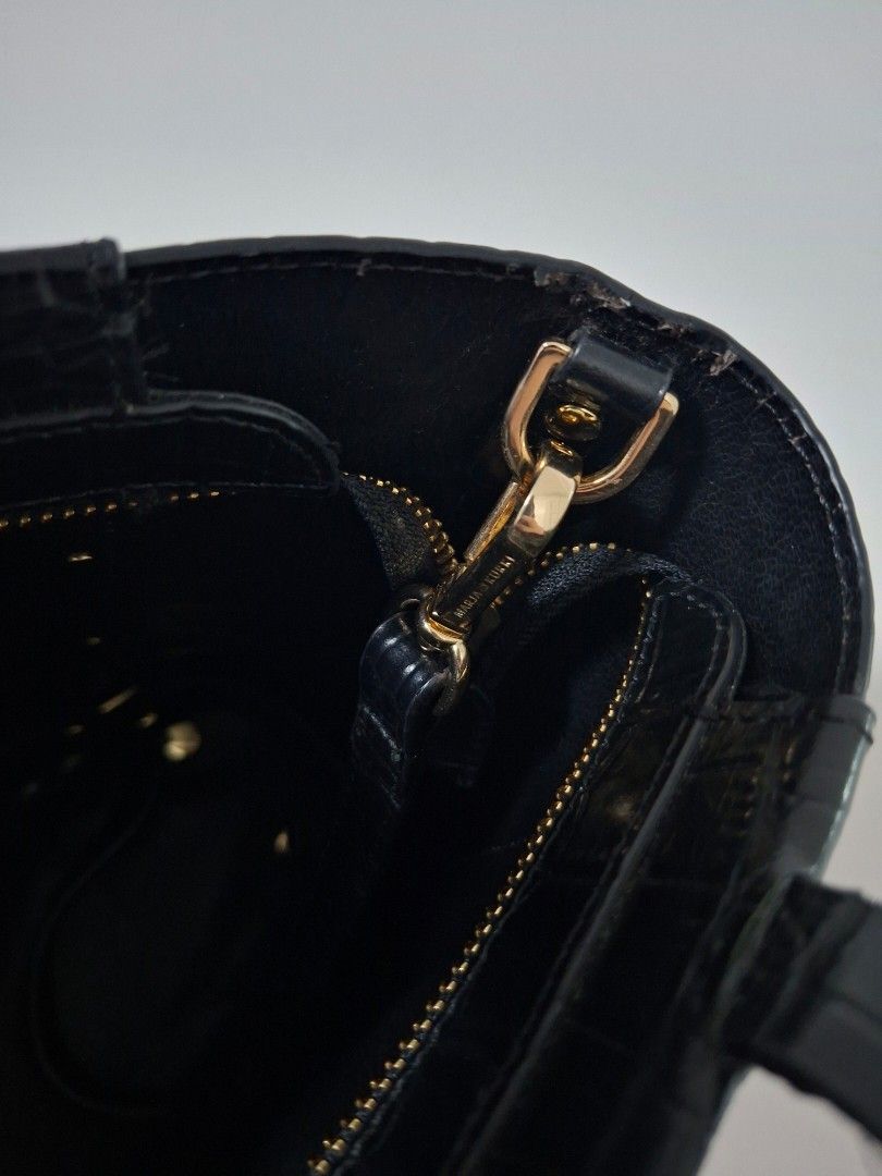 Marja Kurki - Black Croc-Embossed 2Way Bag (Category: Tote Bags) located in Rizal. Submitted by KCS0001 (Listing ID 1422973959, Image 3). Description: - With minimal flaws (rubber lining issue - body and handles) -- selling low - 1800 down to 1300 - Black 2way bag - Croc-embossed texture - Top handle and detachable shoulder strap - Gold-toned hardware - Structured design - Suitable for everyday use.