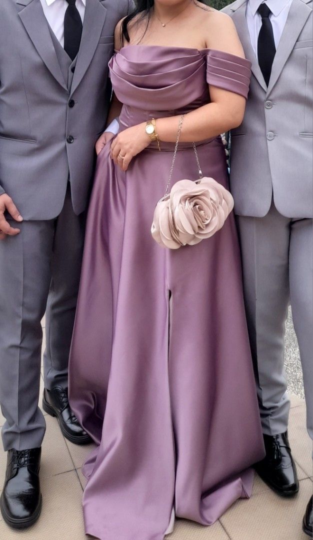 Mauve Off-Shoulder Gown with slit (Category: Evening dresses & gowns) located in Paranaque City. Submitted by xtiina27 (Listing ID 1426252503, Image 1). Description: Mauve Gown used once for medium body frame corset back (lace up) with slit duchess satin fabric.