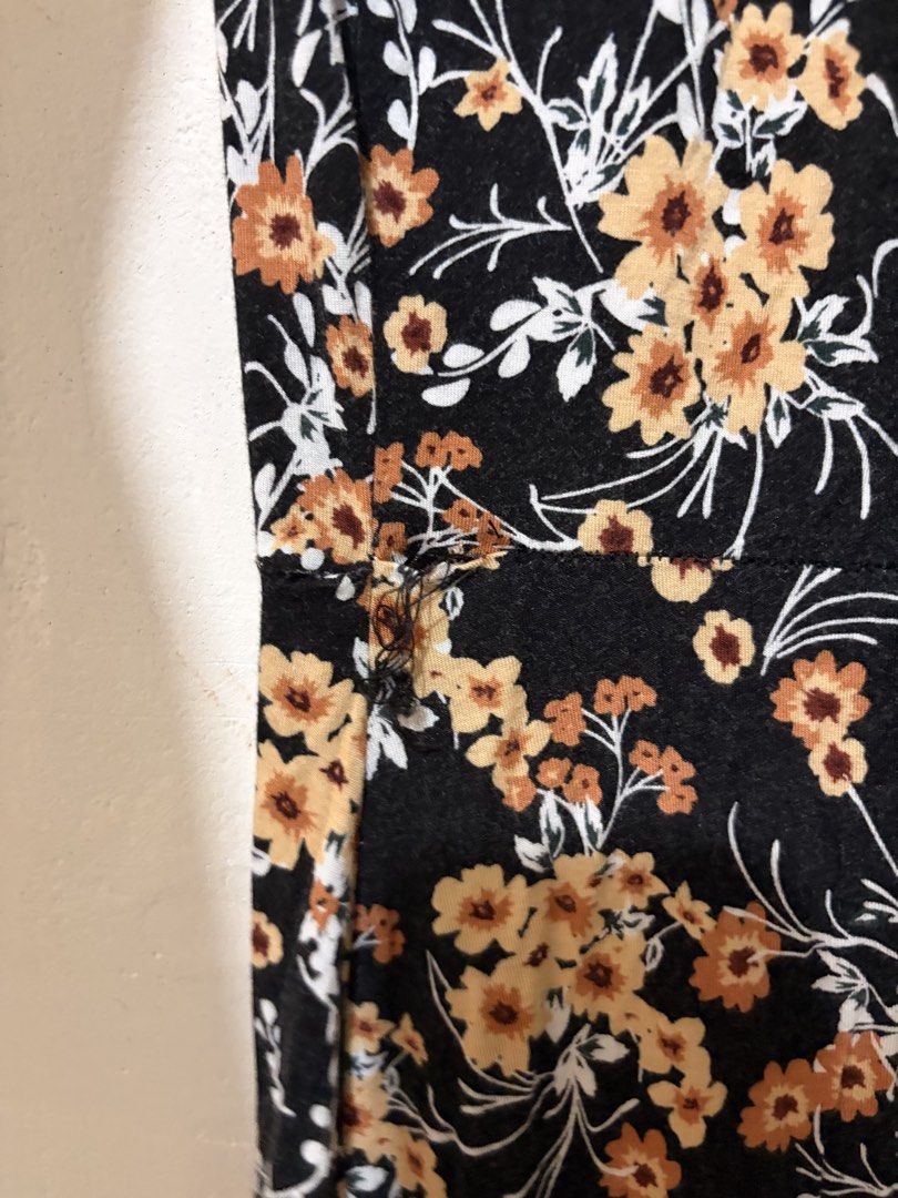 MNG Basics Floral Dress (Category: Dresses) located in Cebu City. Submitted by junneichan (Listing ID 1426313762, Image 3). Description: Black dress with floral print. Features a V-neckline and short sleeves. The dress has a small tear on the side. WILL MEND as requested by buyer!! Size S. Made by MNG Basics. ships from cebu .