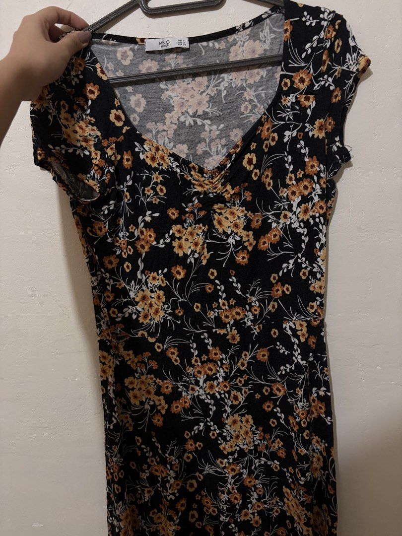 MNG Basics Floral Dress (Category: Dresses) located in Cebu City. Submitted by junneichan (Listing ID 1426313762, Image 2). Description: Black dress with floral print. Features a V-neckline and short sleeves. The dress has a small tear on the side. WILL MEND as requested by buyer!! Size S. Made by MNG Basics. ships from cebu .