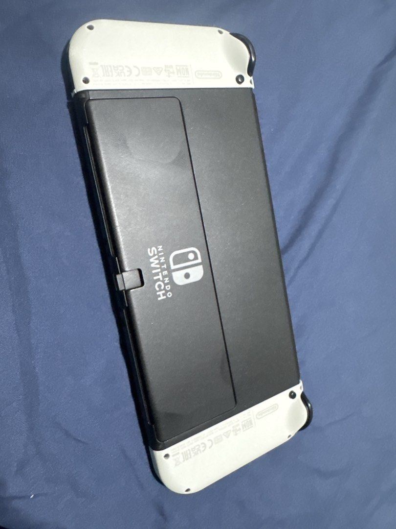 Nintendo Switch OLED (Category: Nintendo) located in Manila. Submitted by cyanide720 (Listing ID 1426256767, Image 2). Description: Nintendo Switch OLED Included: -Unit -Dock -HDMI cable -Charger -Joycon white -Joycon Grip -Dobe controllers 2 pcs RFS: upgrade.