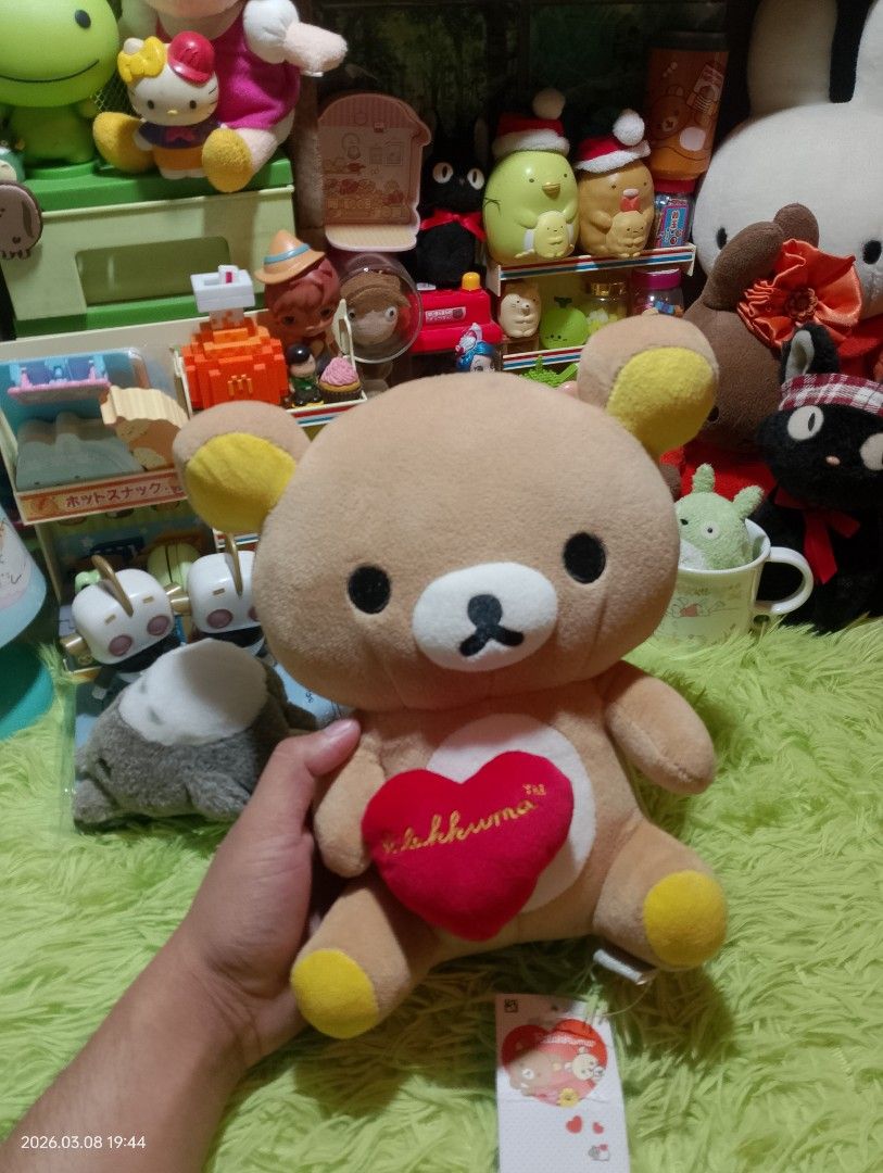 Rilakkuma Plush Toy with Heart (Category: Plushies & Soft Toys) located in Bulacan. Submitted by debur4_freenzy (Listing ID 1426254137, Image 1). Description: Adorable Rilakkuma plush toy featuring a heart-shaped detail. The plush has a zipper design on the back. It is made in Vietnam by C&H Creative Co., Ltd. Comes with original tags. Perfect for Rilakkuma fans or collectors. MOP: Gcash MOD: J&T 💙App: Debura Freenzy 📍Santa Maria, Bulacan.
