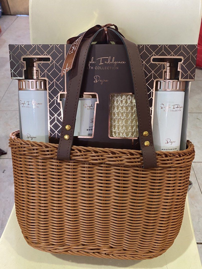 Simple Indulgence Bath Gift Set with Rattan Bag Big (Category: Bath) located in Antipolo. Submitted by momderfulchoice (Listing ID 1426240395, Image 1). Description: Simple Indulgence Bath Gift Set includes body wash, body lotion, body scrub, and a sisal sponge. The body wash and body lotion are 500 ml each, and the body scrub is 220 ml. The set comes in a decorative basket with a brown leather handle. .