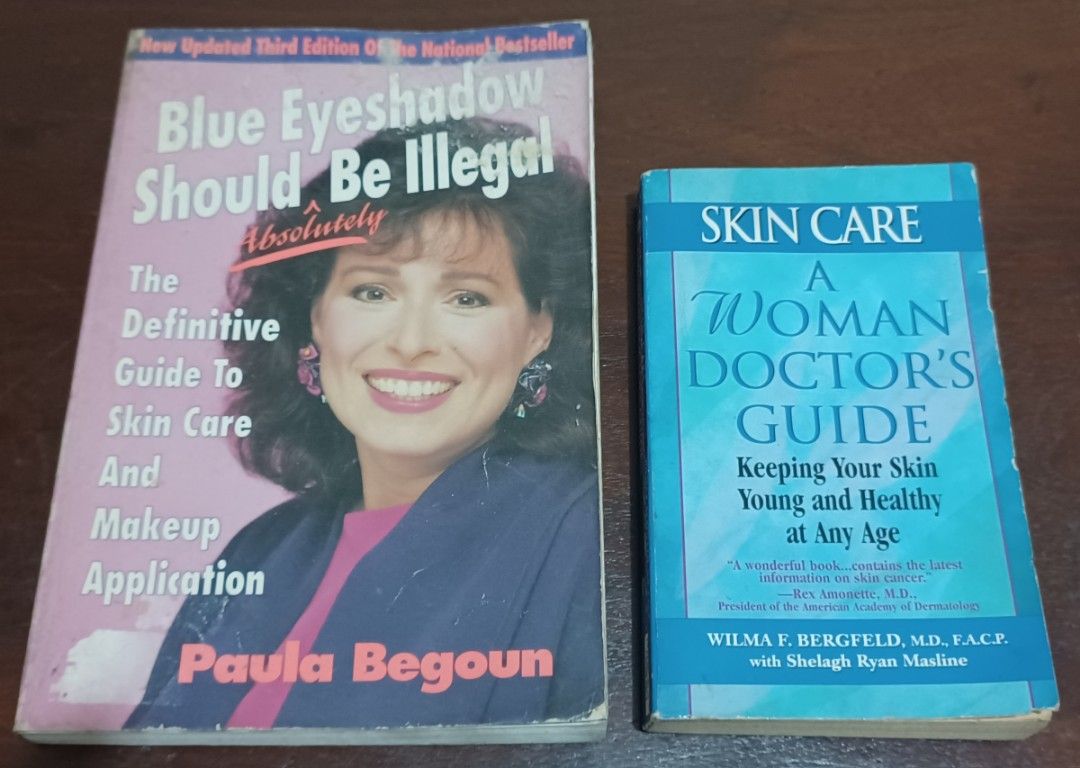 Skin Care and Makeup Books (Category: Makeup) located in Quezon City. Submitted by wjmae (Listing ID 1426303113, Image 1). Description: Two books on skin care and makeup. One is "Blue Eyeshadow Should Be Illegal" by Paula Begoun, and the other is "Skin Care: A Woman Doctor's Guide" by Wilma F. Bergfeld. Both books offer advice on skin care and makeup application. The books are in English..