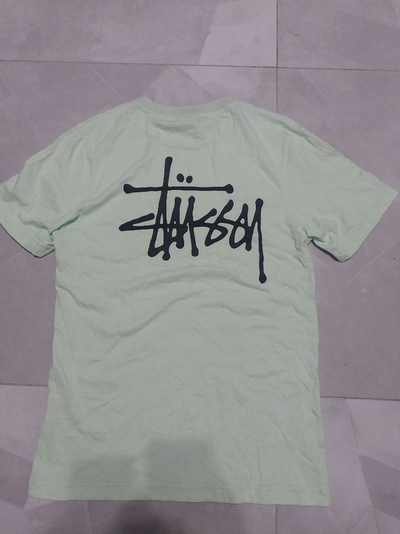 Stussy T-shirt - Mint Green (Category: Tshirts & Polo Shirts ) located in Malaybalay. Submitted by markdaumar08466 (Listing ID 1426301014, Image 2). Description: Mint green Stussy T-shirt. Features the Stussy logo on the front and back. Made in Mexico. Size S. The shirt is made of 100% cotton. Care instructions include machine wash cold, tumble dry low, and do not dry clean..