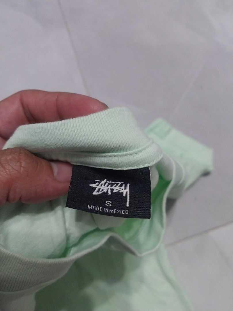 Stussy T-shirt - Mint Green (Category: Tshirts & Polo Shirts ) located in Malaybalay. Submitted by markdaumar08466 (Listing ID 1426301014, Image 3). Description: Mint green Stussy T-shirt. Features the Stussy logo on the front and back. Made in Mexico. Size S. The shirt is made of 100% cotton. Care instructions include machine wash cold, tumble dry low, and do not dry clean..
