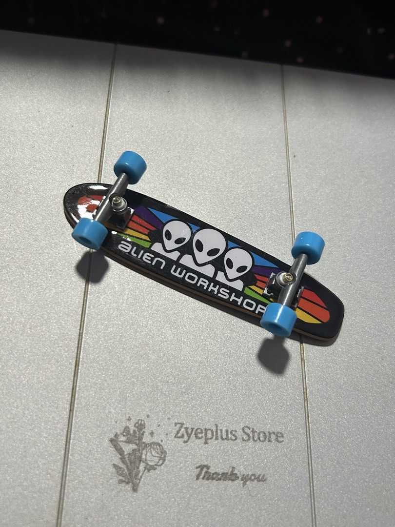 Bo25Tech Deck Fingerboards (Category: Action & Battle Toys) located in Angeles City. Submitted by zyeplustradings (Listing ID 1426214752, Image 2). Description: Two Tech Deck fingerboards are available. One features the Tech Deck logo, and the other has an Alien Workshop design. Both have blue wheels. These fingerboards are designed for tricks and stunts. They are perfect for collectors or anyone who enjoys fingerboarding..