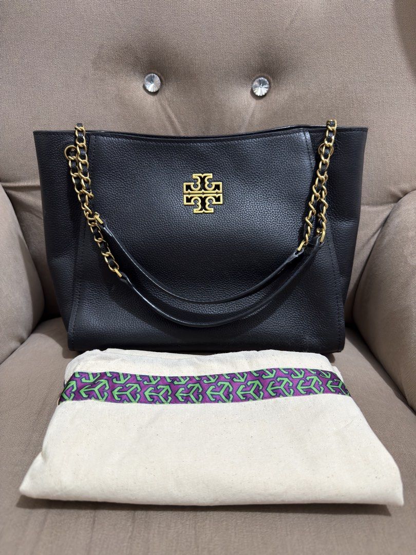 Tory Burch Small Britten Black Leather Tote Bag (Category: Luxury Bags & Wallets) located in Valenzuela. Submitted by eande_manila (Listing ID 1426378196, Image 1). Description: Price drop!!! Good deal for it's condition. Plastic film on zipper pullers still intact Comes with dustbag and paperbag Excellent condition, used only once 100% authentic .