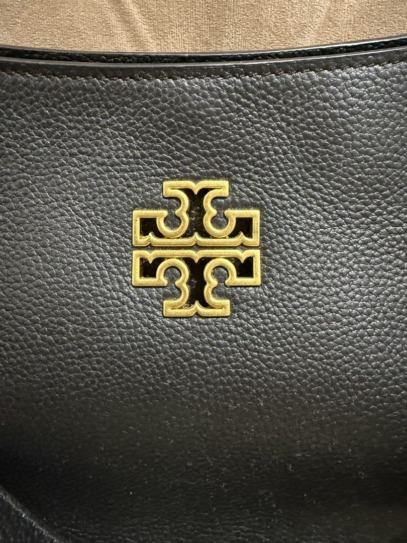 Tory Burch Small Britten Black Leather Tote Bag (Category: Luxury Bags & Wallets) located in Valenzuela. Submitted by eande_manila (Listing ID 1426378196, Image 2). Description: Price drop!!! Good deal for it's condition. Plastic film on zipper pullers still intact Comes with dustbag and paperbag Excellent condition, used only once 100% authentic .
