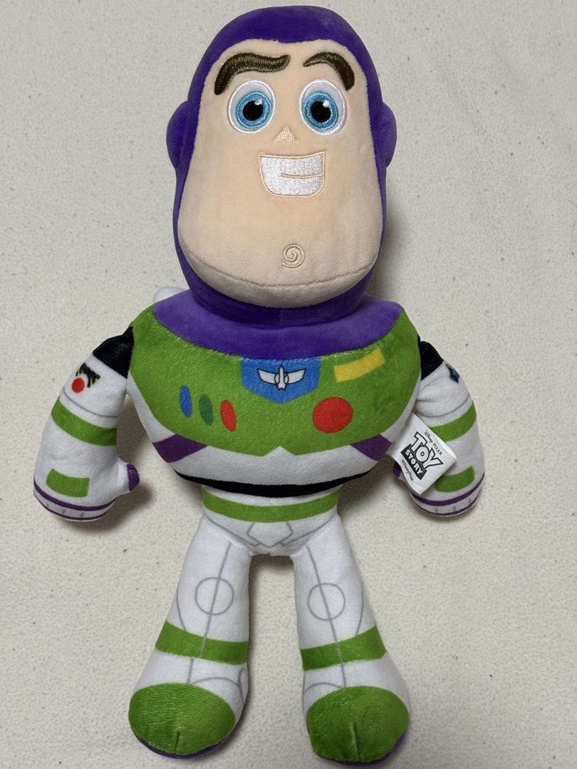 Toy Story Buzz Lightyear Plush Toy (Category: Plushies & Soft Toys) located in Taguig. Submitted by tara_declutters (Listing ID 1426306904, Image 1). Description: - Buzz Lightyear plush toy - Features Buzz's iconic space ranger suit (green, white, and purple) - Detailed design including helmet, face, and wings - Soft and cuddly - Great for kids and collectors.