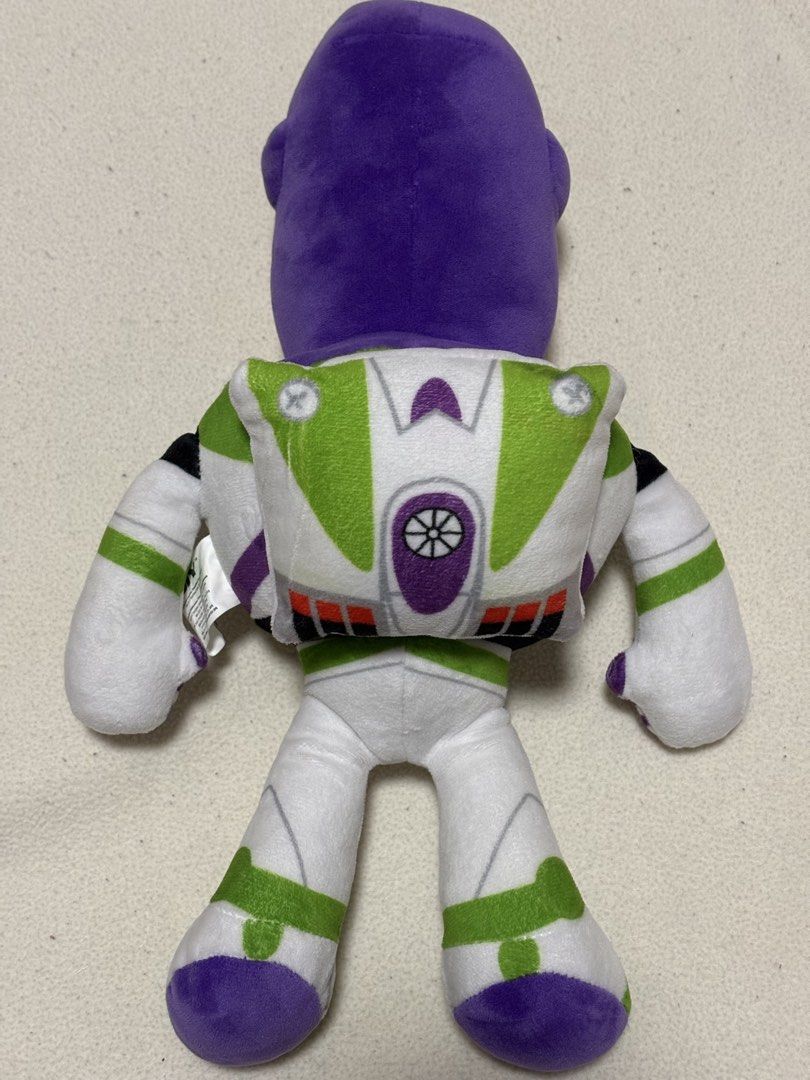 Toy Story Buzz Lightyear Plush Toy (Category: Plushies & Soft Toys) located in Taguig. Submitted by tara_declutters (Listing ID 1426306904, Image 2). Description: - Buzz Lightyear plush toy - Features Buzz's iconic space ranger suit (green, white, and purple) - Detailed design including helmet, face, and wings - Soft and cuddly - Great for kids and collectors.
