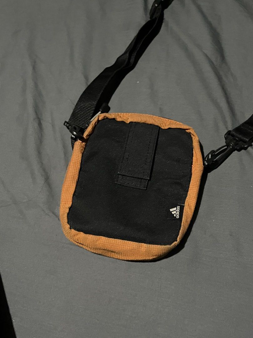 Vintage Adidas Sling Bag (Category: Sling Bags) located in Las Pinas. Submitted by secondskinph (Listing ID 1426312122, Image 2). Description: Vintage Adidas Sling Bag – Rare • Rare vintage Adidas sling bag • Adjustable strap with secure zip compartments • Compact yet functional • Ideal for collectors or streetwear enthusiasts • Color may vary due to lighting • Condition: Excellent / 9/10 • CR: 9/10 • P699 .