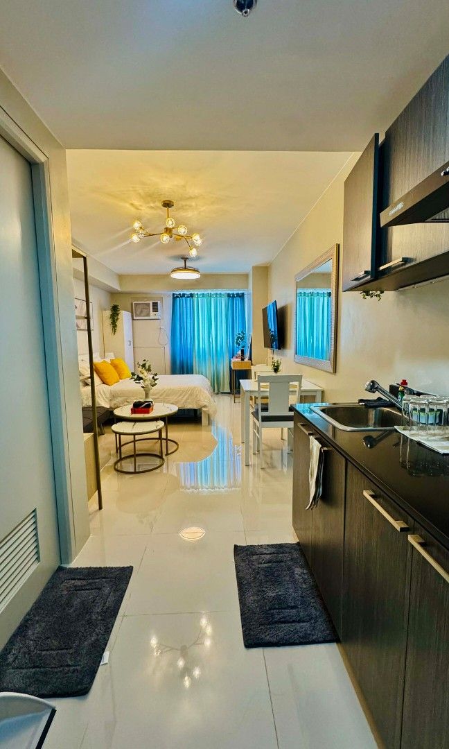 Vista Shaw Staycation (Category: Vacation Rentals) located in Paranaque City. Submitted by christinehsoon (Listing ID 1426288125, Image 1). Description: Experience "small-scale luxury" in this thoughtfully designed 27sqm sanctuary. Perfectly curated for style-conscious travelers, this unit maximizes every square inch with marble accents, gold finishes, and a refreshing teal palette. It’s the ultimate cozy base for your city adventure. ​ ​Sleeping
