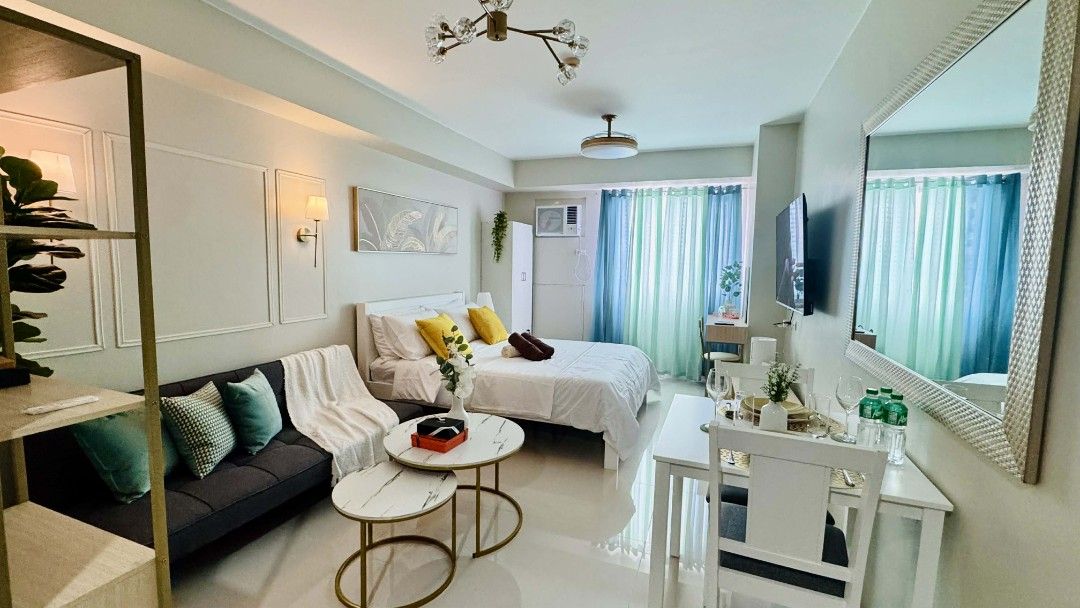 Vista Shaw Staycation (Category: Vacation Rentals) located in Paranaque City. Submitted by christinehsoon (Listing ID 1426288125, Image 2). Description: Experience "small-scale luxury" in this thoughtfully designed 27sqm sanctuary. Perfectly curated for style-conscious travelers, this unit maximizes every square inch with marble accents, gold finishes, and a refreshing teal palette. It’s the ultimate cozy base for your city adventure. ​ ​Sleeping