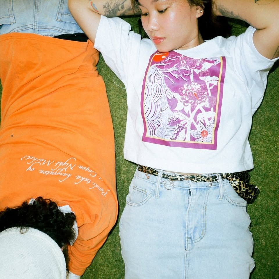 Artist-Designed White Graphic Shirt (Category: Shirts) located in Cagayan de Oro. Submitted by offanglesandcolors (Listing ID 1426442375, Image 3). Description: This shirt is print-on-demand 🌱 Each shirt is printed just for you, which means production can take 1–3 weeks depending on: • the type of shirt you choose • whether you want it cropped or regular length 👕 Fit & Customization • You can choose any size • Option for cropped or regular • Sh