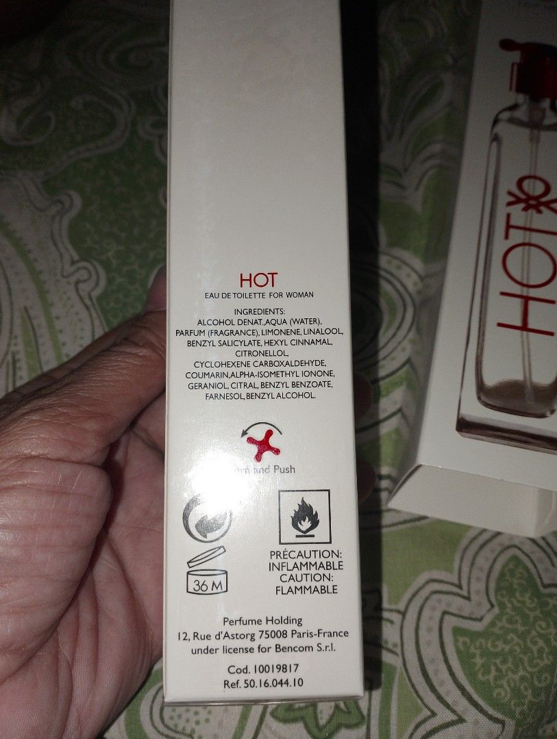 Benetton Hot For Her 100ml EDT (Category: Fragrance & Deodorants) located in Pasig City. Submitted by enajp82 (Listing ID 1426538273, Image 3). Description: Authentic Benetton Hot For Her Eau de Toilette. This 100ml perfume is for women. The box includes the ingredients and manufacturing details. Made in Italy. The perfume has a red cap and the bottle has the Benetton logo..